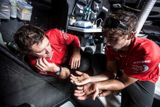 Doctor Antonio Cuervas-Mons 'Neti' comparing Willy Altadils hands to see the improvements - Volvo Ocean Race 2014-15 © Francisco Vignale/Mapfre/Volvo Ocean Race